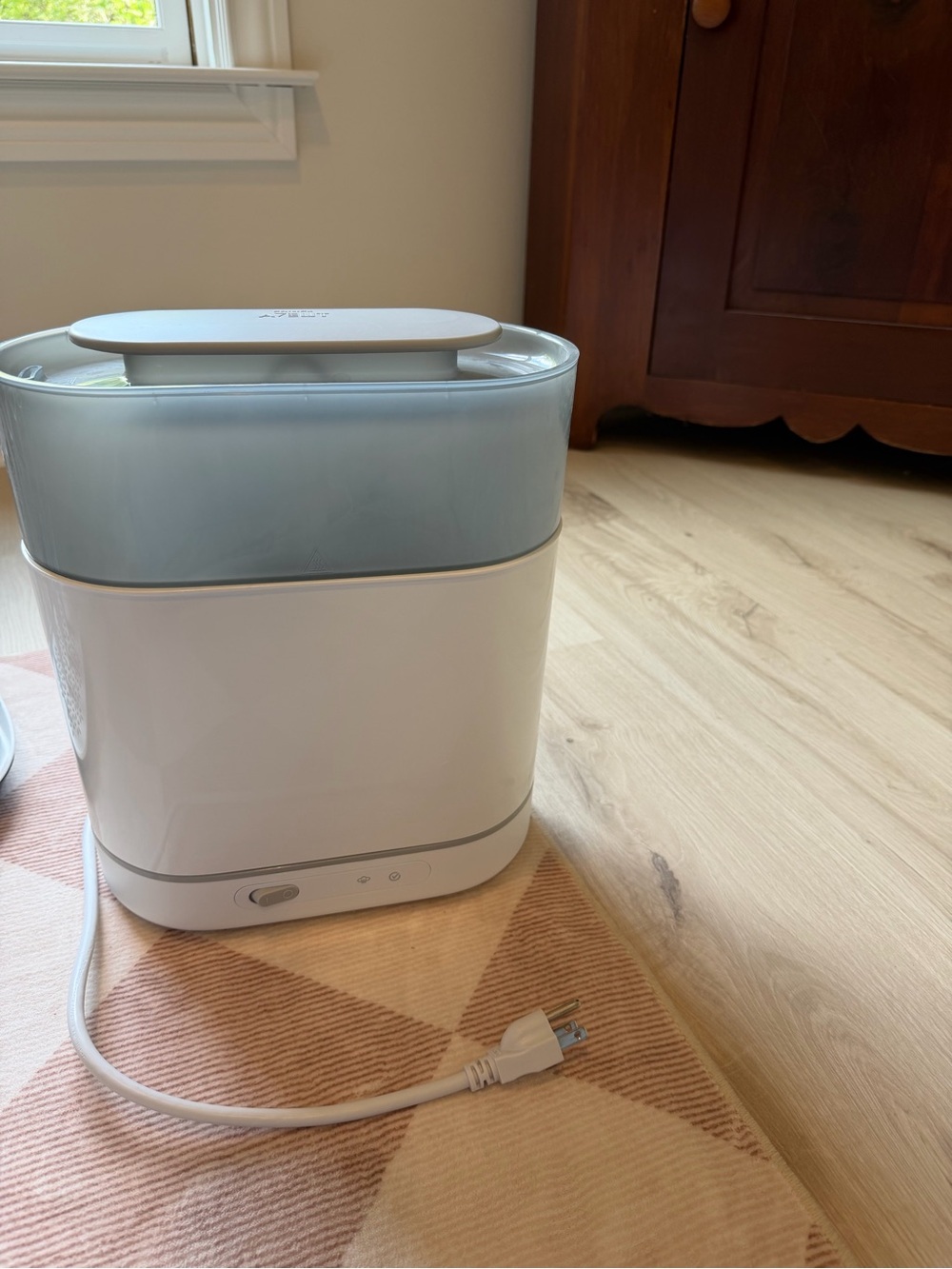 White and Light Gray Bottle Sterilizer